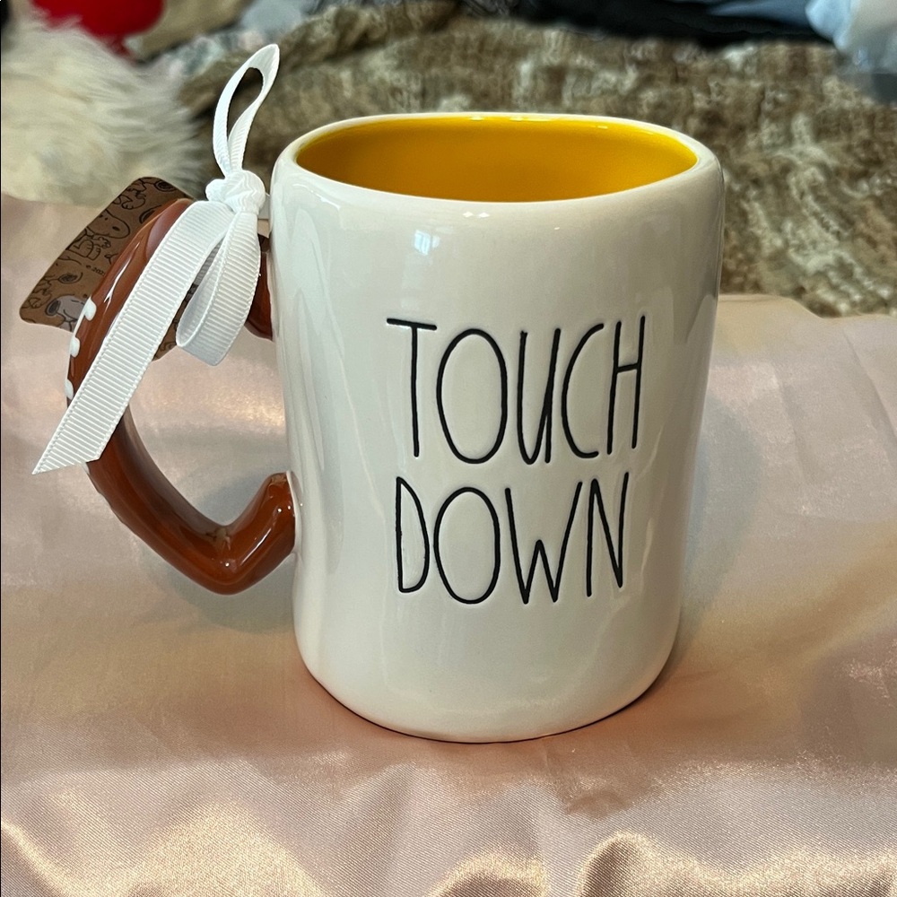 NWT Rae Dunn Peanuts Touch Down Mug - White exterior yellow interior
